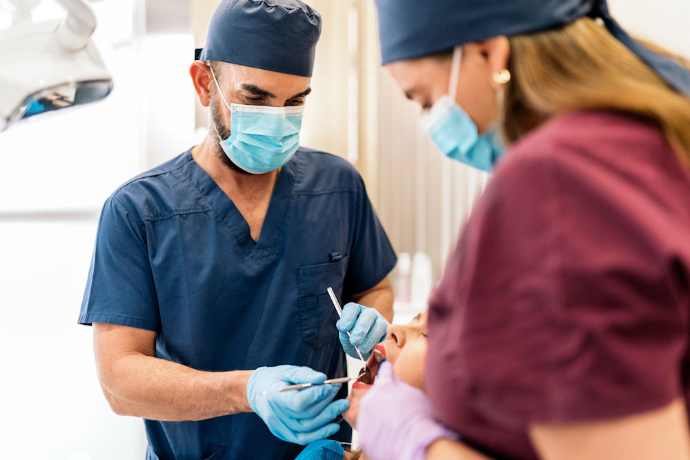 Dentist with Personal Protective Equipment PPP.